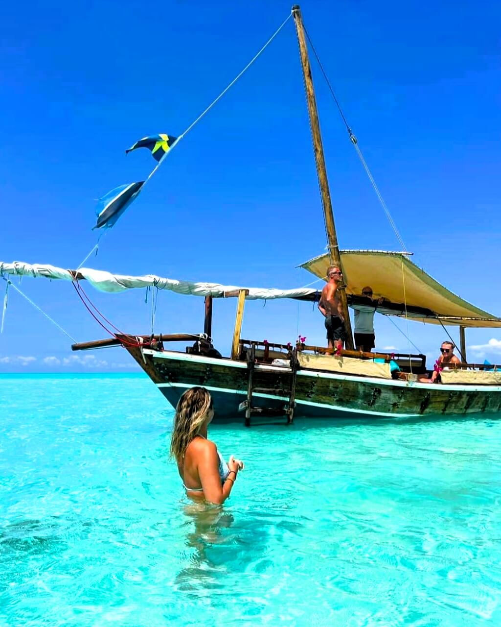 Snorkelers exploring coral reef at Mnemba Island