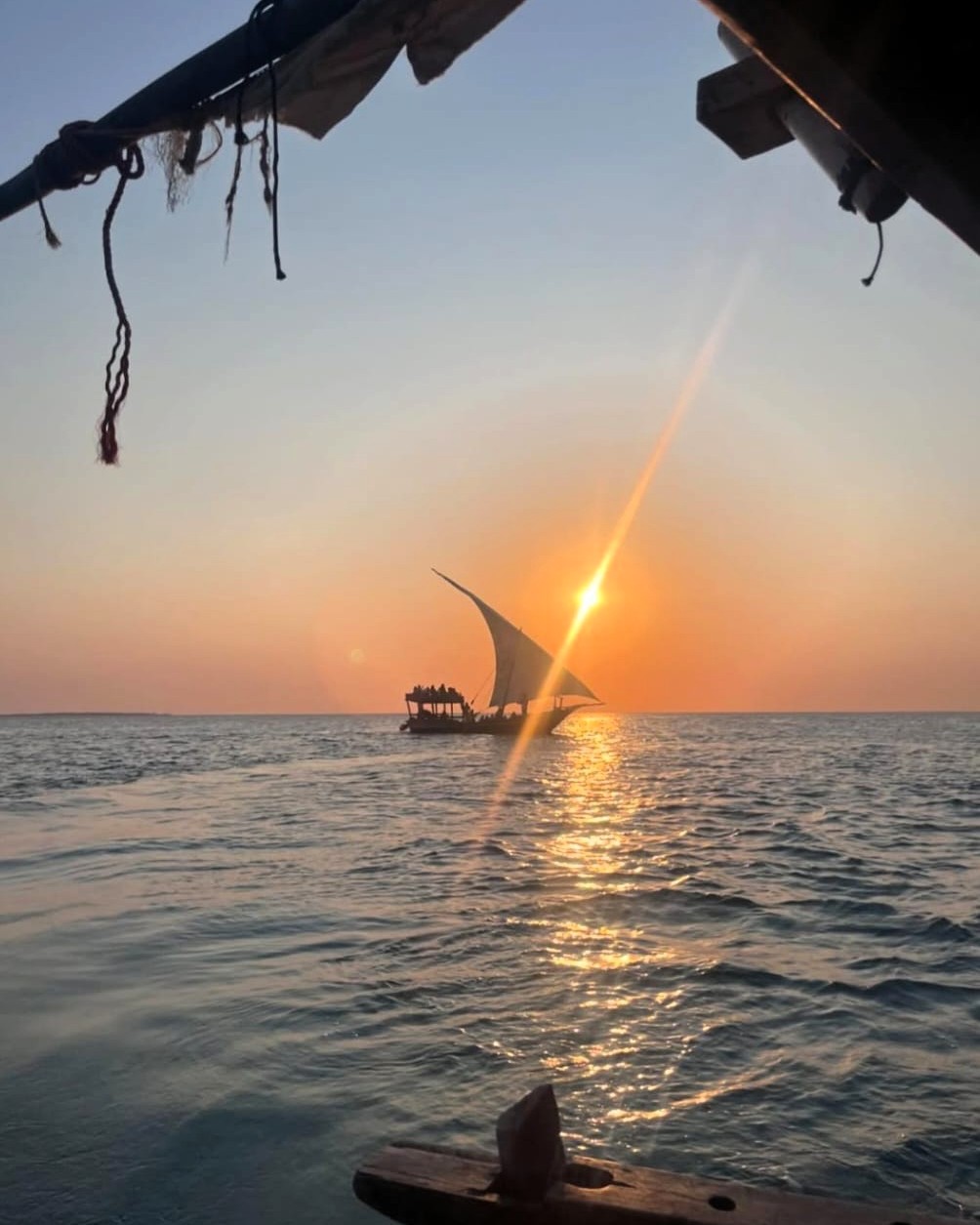 Golden sunset over the ocean on a traditional dhow cruise